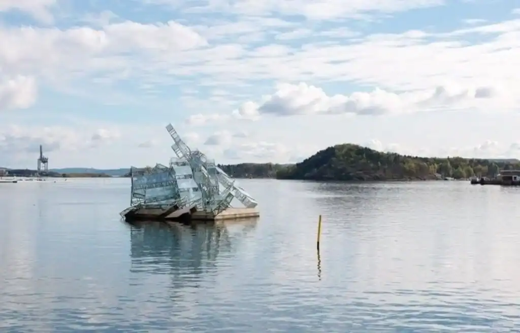 The open fjords with a sculpture in the water in Aker Brygge, one of the best places to stay in Oslo