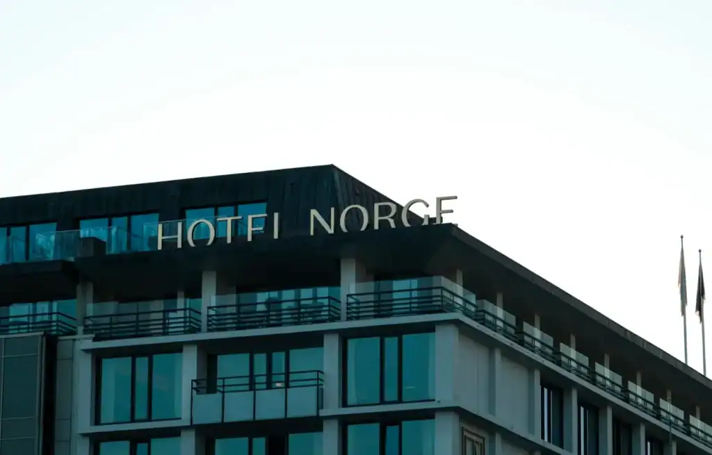 Close-up of the top of Hotel Norge in Bergen with clear sky background.
